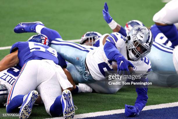 Ezekiel Elliott of the Dallas Cowboys dives for a touchdown against the New York Giants during the second quarter at AT&T Stadium on October 11, 2020...