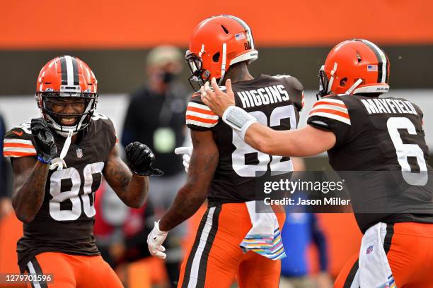 Jarvis Landry, Rashard Higgins, and Baker Mayfield of the Cleveland Browns celebrate after scoring a touchdown in the second quarter against the...