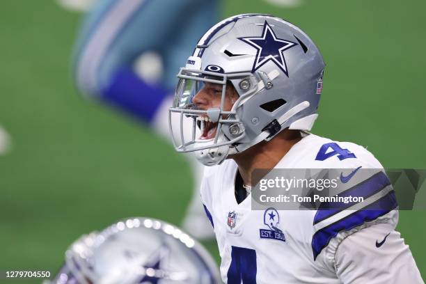 Dak Prescott of the Dallas Cowboys celebrates his touchdown reception against the New York Giants during the second quarter at AT&T Stadium on...