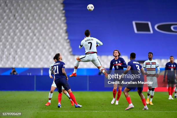 Cristiano Ronaldo of Portugal jumps for the ball during the UEFA Nations League group stage match between France and Portugal at Stade de France on...