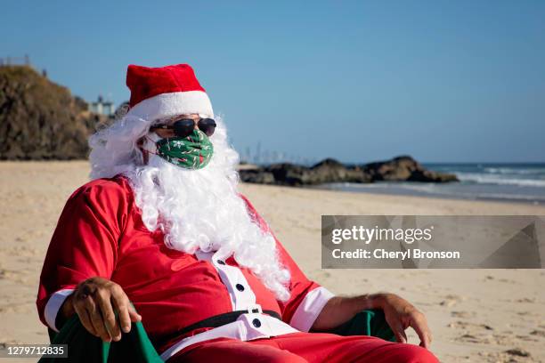 covid 19 summer santa - queensland coronavirus stock pictures, royalty-free photos & images