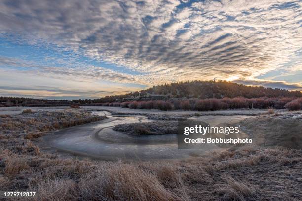 altocumulus clouds over central oregon river and grassland, winter - altocumulus stock pictures, royalty-free photos & images