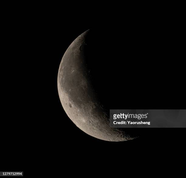 the waning crescent moon ,view from asia area - crescent fotografías e imágenes de stock