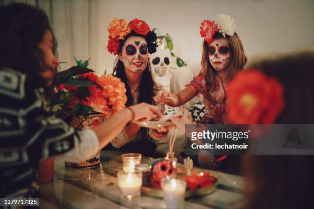 mom celebrating day of the dead with her daughter at home - day of the dead stock pictures, royalty-free photos & images