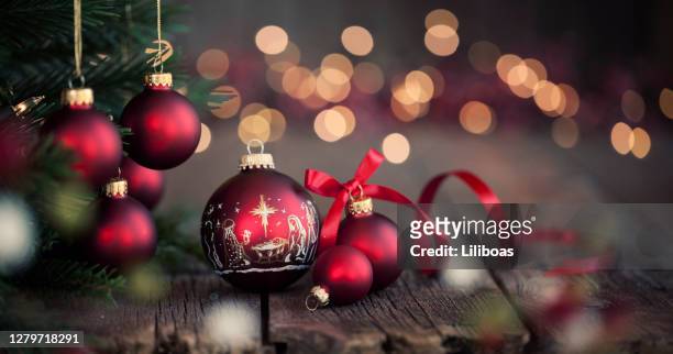 christmas tree and nativity ornaments on an old wood background - beautiful jesus christ stock pictures, royalty-free photos & images
