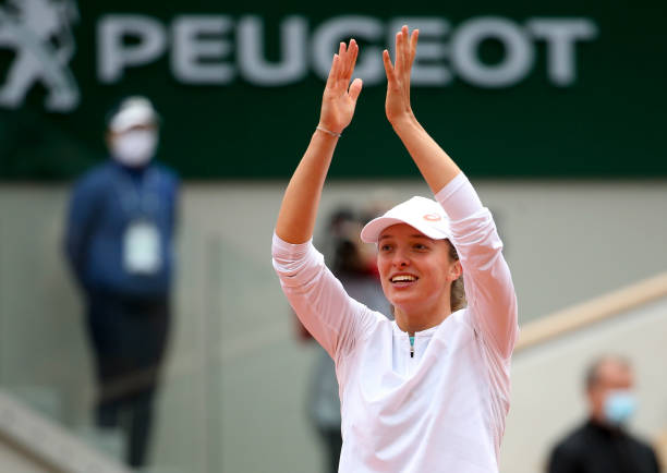 Iga Swiatek of Poland celebrates winning the Women's Final during day 14 of the 2020 French Open on Court Philippe Chatrier at Roland Garros stadium...