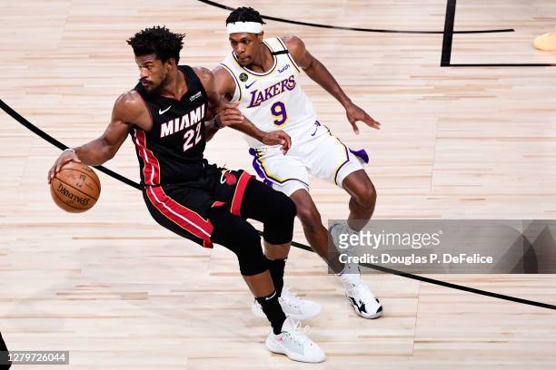 Rajon Rondo of the Los Angeles Lakers defends Jimmy Butler of the Miami Heat during the fourth quarter in Game Six of the 2020 NBA Finals at...