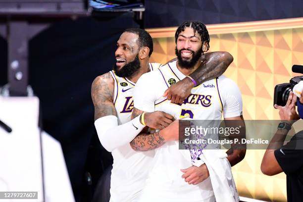 LeBron James of the Los Angeles Lakers and Anthony Davis of the Los Angeles Lakers react after winning the 2020 NBA Championship in Game Six of the...
