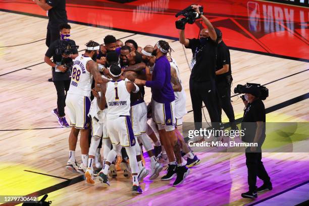 The Los Angeles Lakers celebrate after winning the 2020 NBA Championship Final over the Miami Heat in Game Six of the 2020 NBA Finals at AdventHealth...