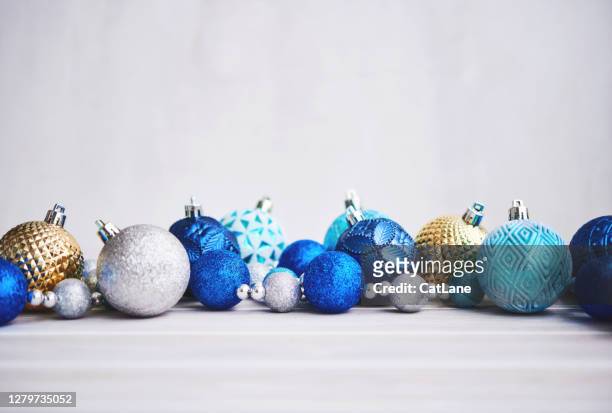 christmas background with blue silver and gold ornaments - royal blue stock pictures, royalty-free photos & images