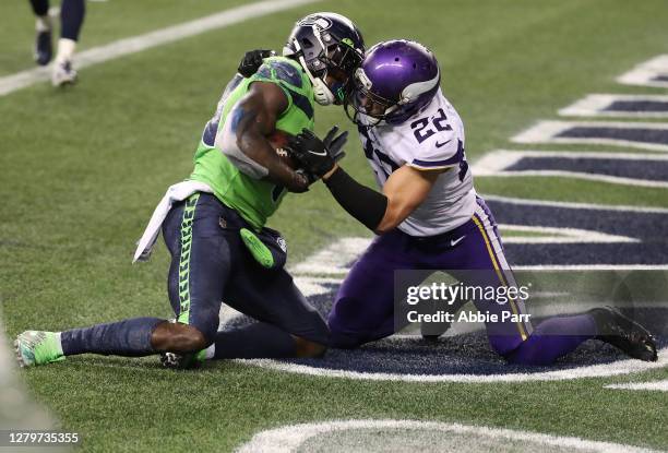 Metcalf of the Seattle Seahawks catches the game winning touchdown pass against Harrison Smith of the Minnesota Vikings during the fourth quarter at...