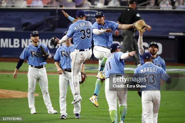 Kevin Kiermaier and Willy Adames of the Tampa Bay Rays celebrate their teams 2-1 victory against the Houston Astros in game one of the American...