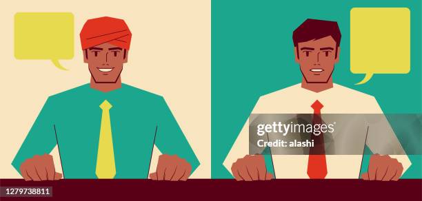 handsome young indian ethnicity businessman (manager, chairman, newscaster, politician) is sitting at a table and talking with a facial expression of smile and seriousness; business meeting, conference, or interview - chairperson stock illustrations