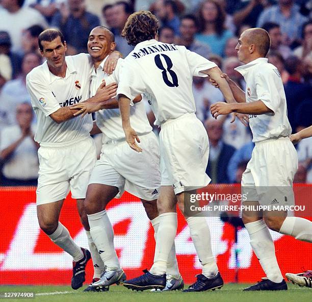 Real Madrid Brazilian Ronaldo is gratulated by his teammates French Zinedine Zidane British Steve McManaman and Argentine Esteban Cambiasso after...