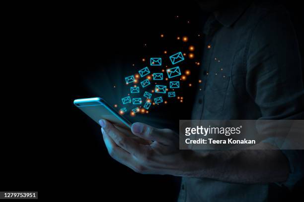 close up of business man using mobile smart phone sending email - e mail foto e immagini stock