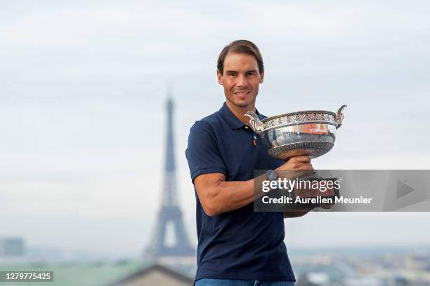 Rafael Nadal of Spain poses on the roof of Les Galeries Lafayette with Les Mousquetaires trophy following his victory in the Men's Singles Finals...