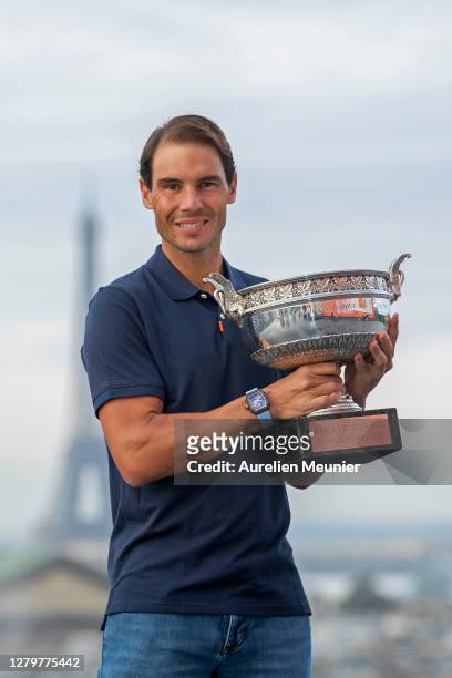 Rafael Nadal of Spain poses on the roof of Les Galeries Lafayette with Les Mousquetaires trophy following his victory in the Men's Singles Finals...