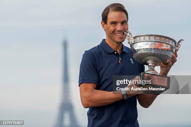 Rafael Nadal of Spain poses on the roof of Les Galeries Lafayette with Les Mousquetaires trophy following his victory in the Men's Singles Finals...