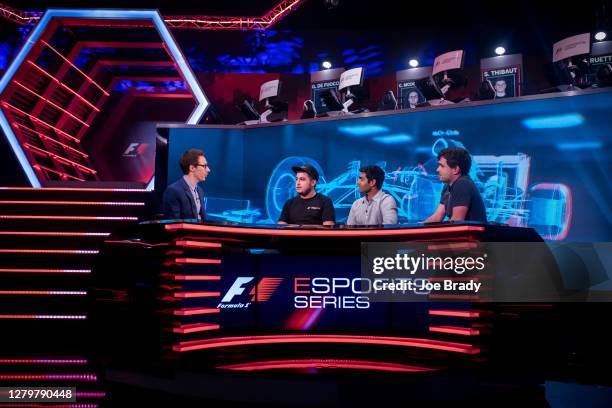 Show host Tom Deacon talks to Patrick Holzmann, Karun Chandhok and Matt Gallagher during the 2017 F1 Esports Pro Series broadcast at the GFinity...