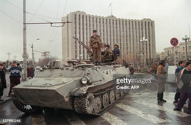 Chechen separatist soldier stands on an APC, guarding the presidential palace on Grozny's central square, on November 25, 1994. Tension is rising in...