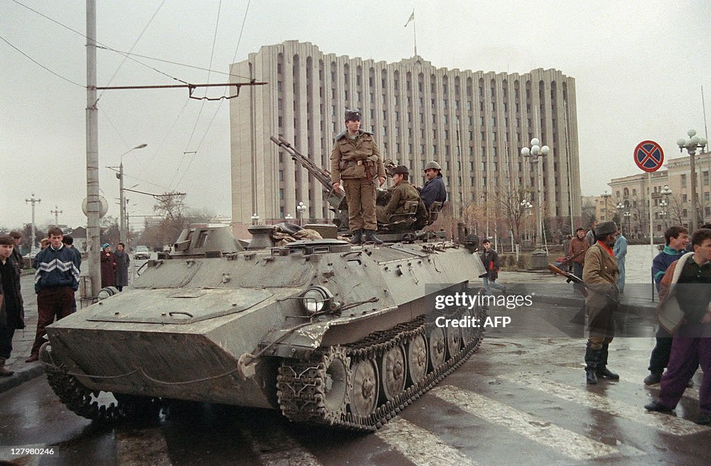 A Chechen separatist soldier stands on a