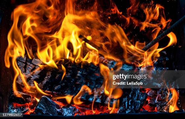 burning firewood in the grill, bright coals and flames - burning coal stock pictures, royalty-free photos & images