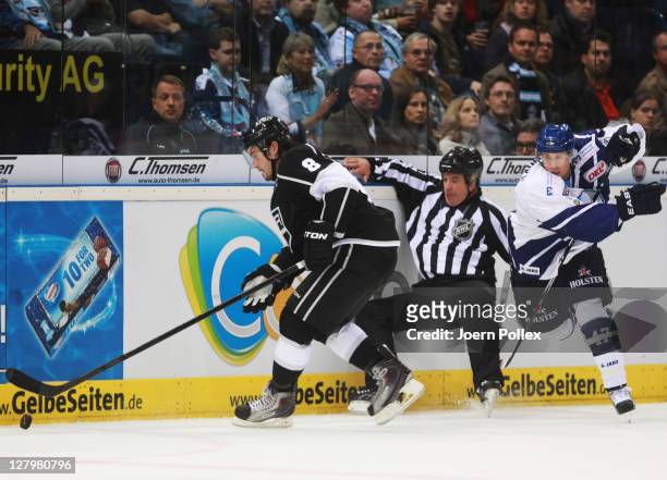 Brendan Brooks of Hamburg tackles Drew Doughty of Los Angeles during the NHL Pre-Season game between Hamburg Freezers and Los Angeles Kings at the O2...