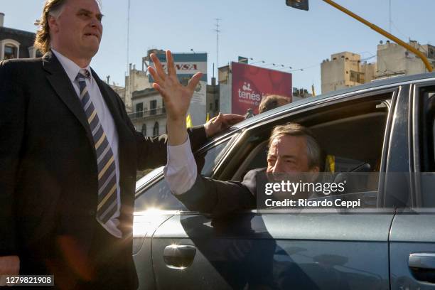 Former President Nestor Kirchner greets supporters from a car after his wife Cristina Fernandez de Kirchner assumes as Constitutional President on...