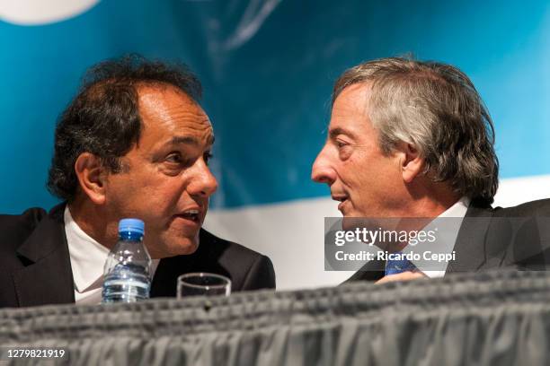 Former President Nestor Kirchner speaks with Buenos Aires Province Governor, Daniel Scioli during elections rally for Deputy on October 27, 2009 in...