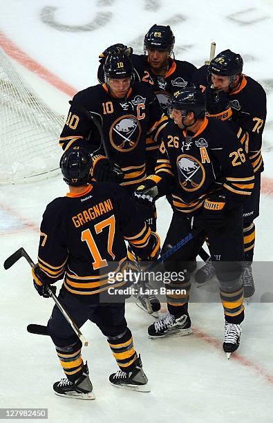 Thomas Vanek of Buffalo celebrates with Christian Ehrhoff and other team mates after scoring a goal during the NHL Pre-Season match between Buffalo...