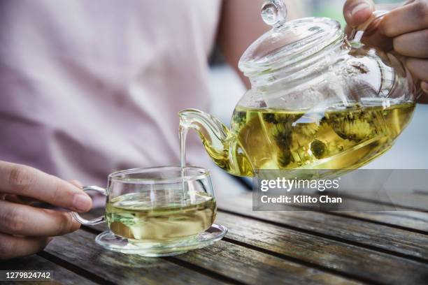 asian woman enjoy a cup of herbal tea - herbal tea fotografías e imágenes de stock