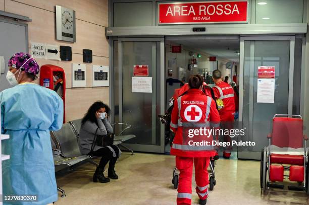 The staff of the red cross during the transport of a patient to the emergency room in the Mauriziano hospital on October 12, 2020 in Turin, Italy....