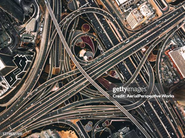 drone point view of road intersection / dubai, uae - dubai road stock pictures, royalty-free photos & images