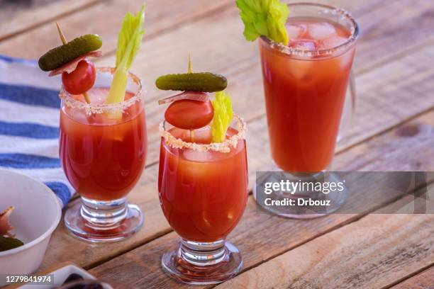 bloody mary cocktail n glass on table - bloody mary stock pictures, royalty-free photos & images