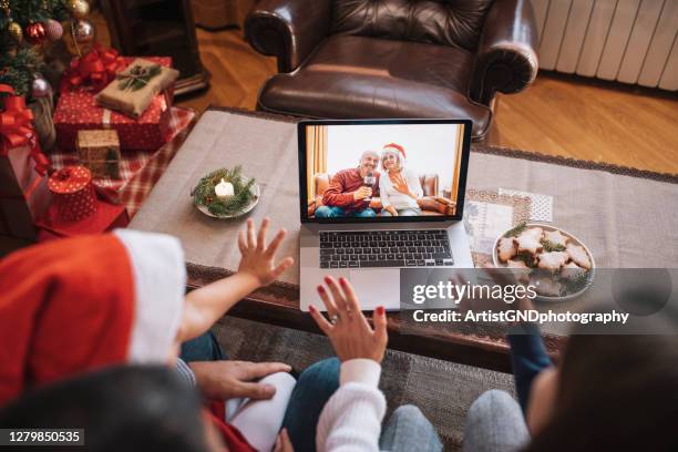 family in christmas video call. - christmas zoom stock pictures, royalty-free photos & images