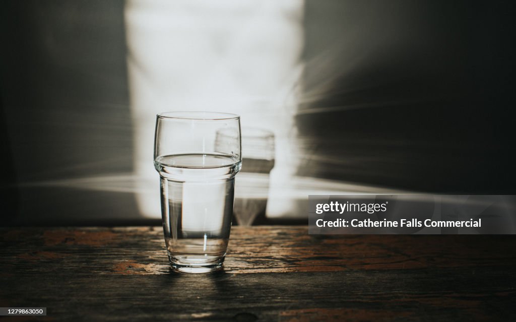 Glass of Water on a Rustic Wooden Table