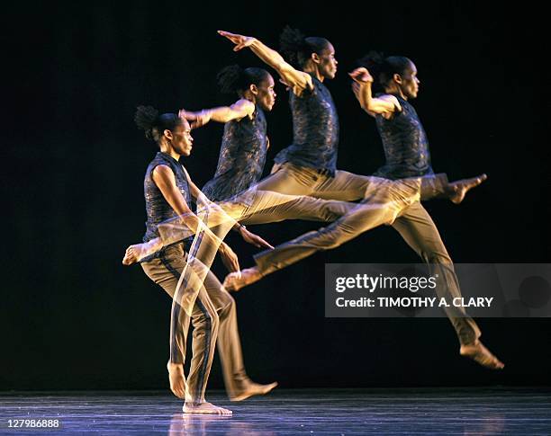 In this multiple exposure photo, dancer Nicolette Depass from Garth Fagan Dance perform a scene from the world premier of "Madiba" during a dress...