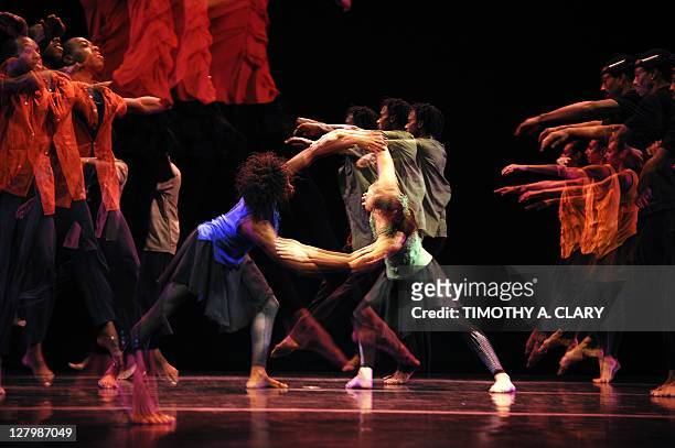 In this multiple exposure photo, dancers from Garth Fagan Dance perform a scene from the world premier of "Madiba" during a dress rehearsal before...