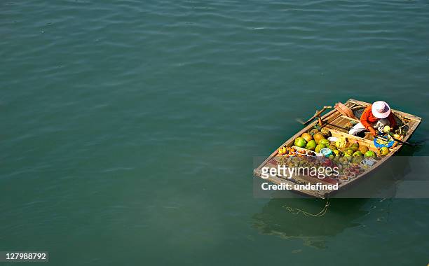 selling fruits in boat - floating market stock pictures, royalty-free photos & images