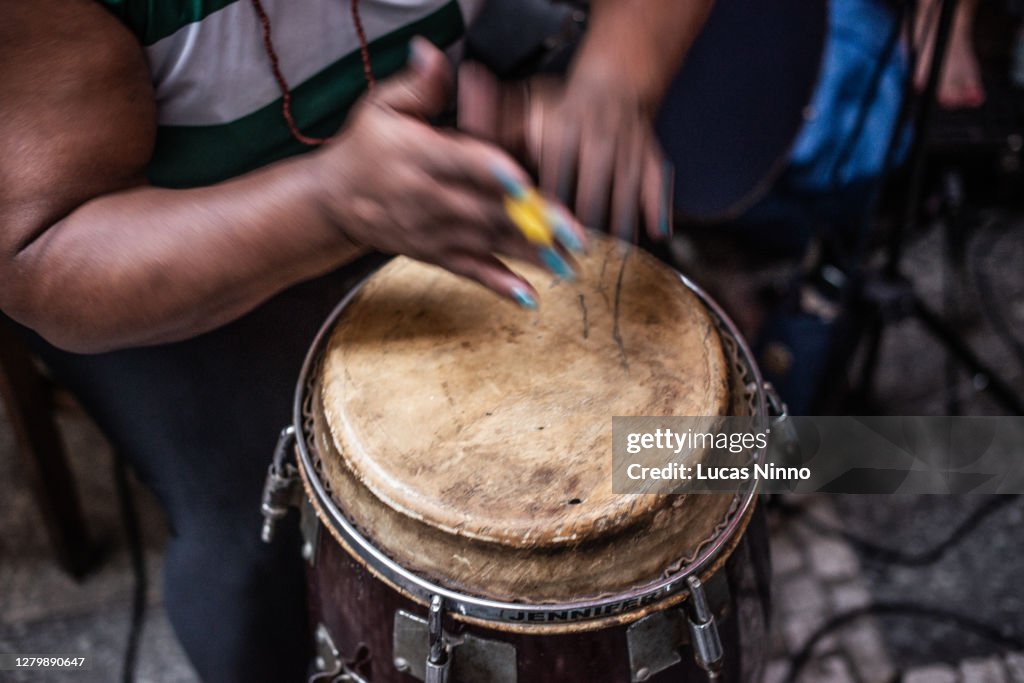 Woman playing drum - brazilian atabaque