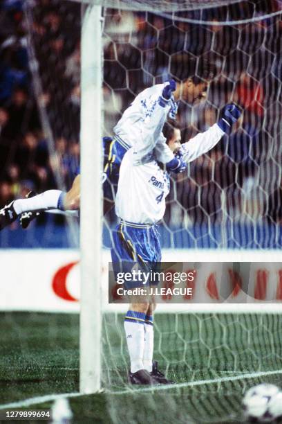 Mladen Mladenovic of Gamba Osaka celebrates scoring a goal with his team mate Hiromitsu Isogai during the J.League match between Yokohama Marinos and...