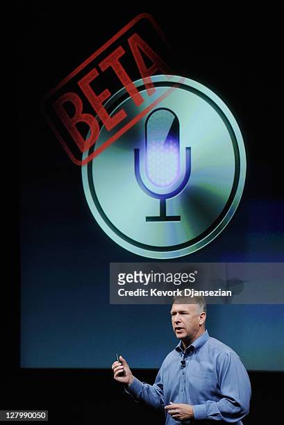 Apple's Senior Vice President of Worldwide product marketing Phil Schiller speaks about the new voice recognition app called Siri during introduction...