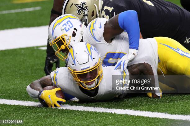 Nasir Adderley of the Los Angeles Chargers is tackled at the one-yard line after an interception of Drew Brees of the New Orleans Saints during their...