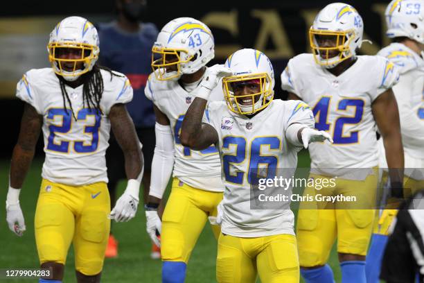 Casey Hayward of the Los Angeles Chargers reacts to an interception by Nasir Adderley against the New Orleans Saints during their NFL game at...