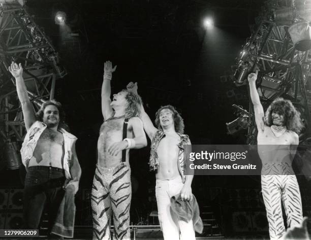 Eddie Van Halen, David Lee Roth, Alex Van Halen and Michael Anthony of the rock group Van Halen performs at the Forum in May, 1984 in Inglewood,...