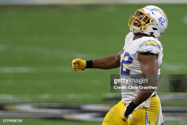 Uchenna Nwosu of the Los Angeles Chargers celebrates after a sack of Drew Brees of the New Orleans Saints during their NFL game at Mercedes-Benz...