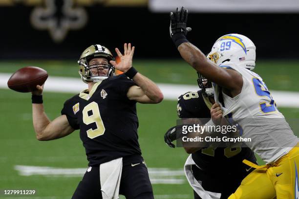 Drew Brees of the New Orleans Saints throws a 41-yard touchdown to Jared Cook against the Los Angeles Chargers during their NFL game at Mercedes-Benz...
