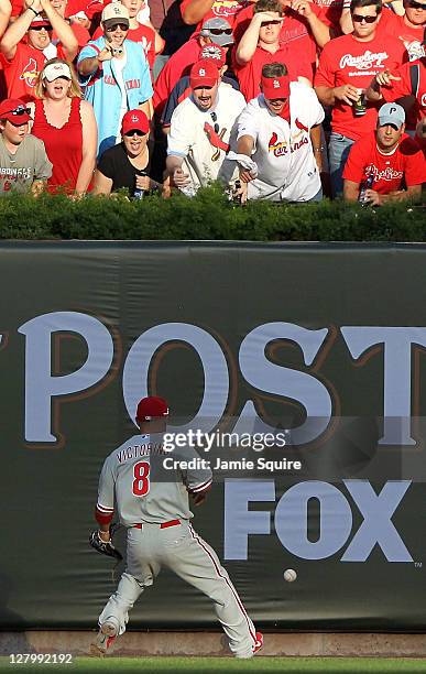 Shane Victorino of the Philadelphia Phillies chases down a double by Albert Pujols of the St. Louis Cardinals in the fifth inning of Game Three of...
