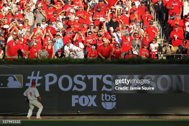 Shane Victorino of the Philadelphia Phillies chases down a double by Albert Pujols of the St. Louis Cardinals in the fifth inning of Game Three of...