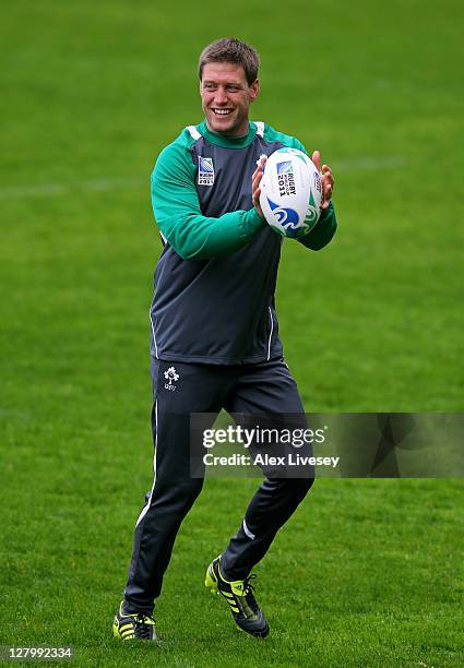 Flyhalf Ronan O'Gara passes the ball during an Ireland IRB Rugby World Cup 2011 training session at Rugby League Park on October 5, 2011 in...